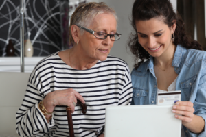 An elderly woman with a disability works with her beneficiary with her probate process.