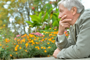 a man in the community sits and thinks about his last will and long term care planning.