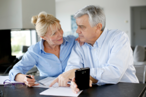 elderly couple looks over their will through elder law.