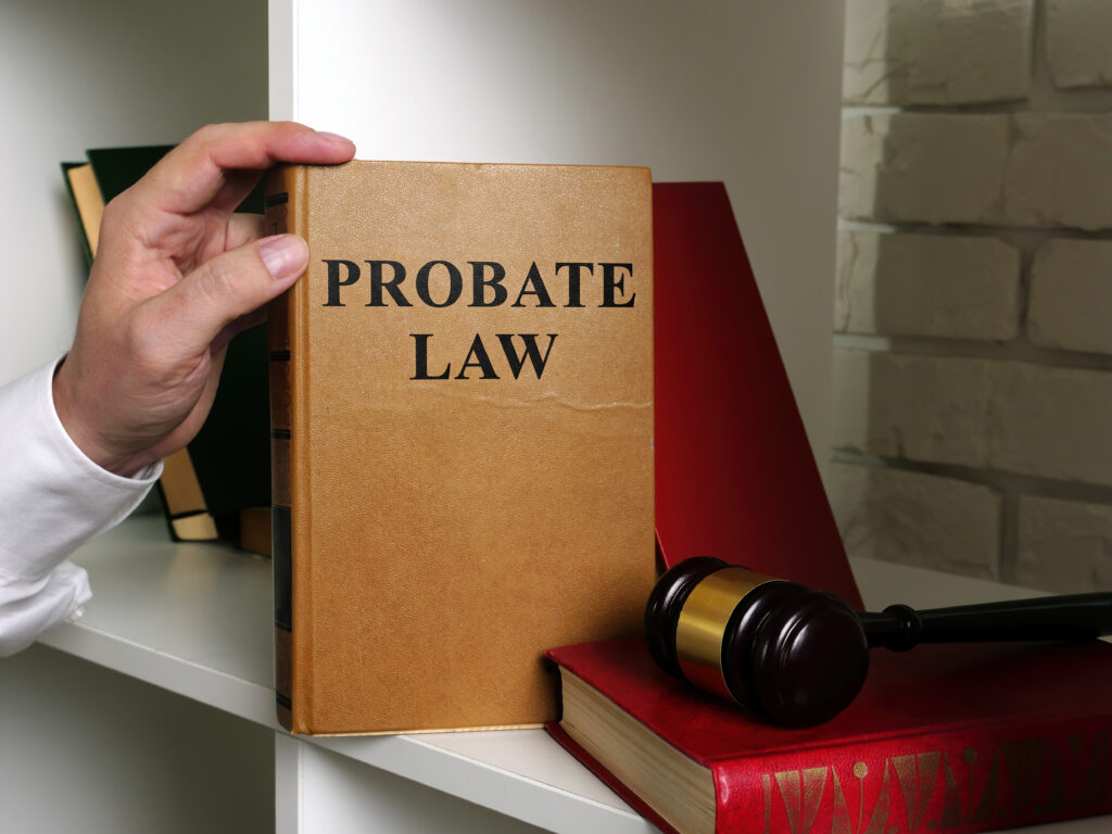 probate law book being pulled off a bookshelf